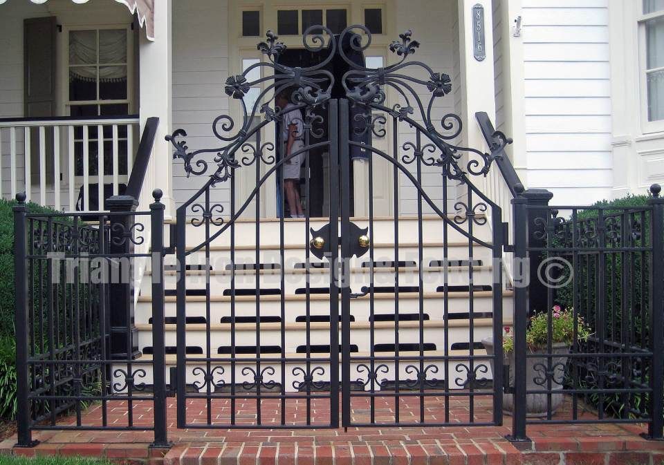 closeup view of the wrought iron gate at the house