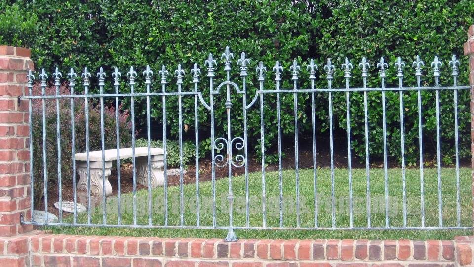 closeup view of ornamental iron fencing at the gate 