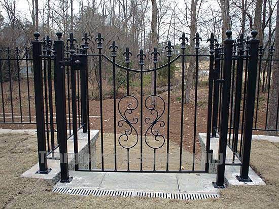 wrought iron gate installed near forest