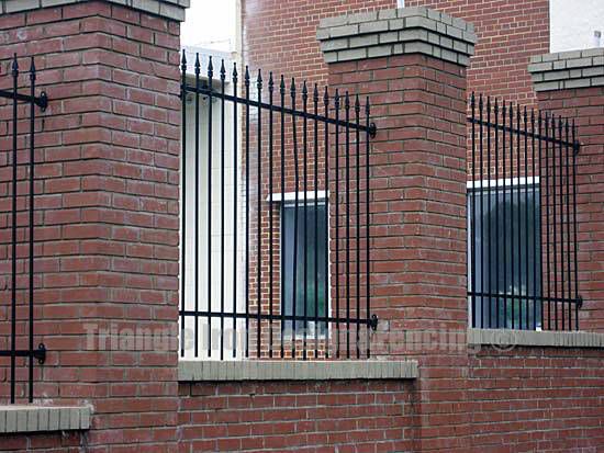 custom iron fencing installed in the wall
