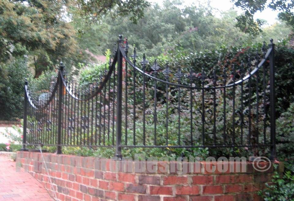 closeup view of the custom iron fencing installed in the wall