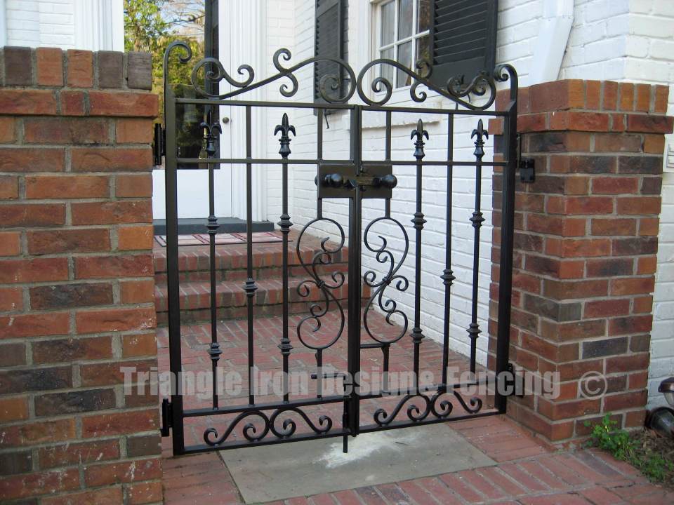 wrought iron gate installed outside house