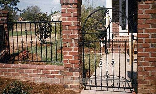 wrought iron gate installed in the wall