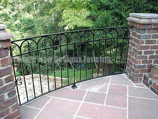 custom iron railings installed at the gate