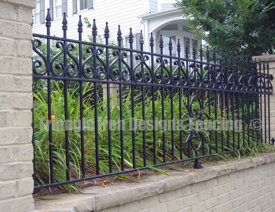closeup view of the iron fencing installed in the wall