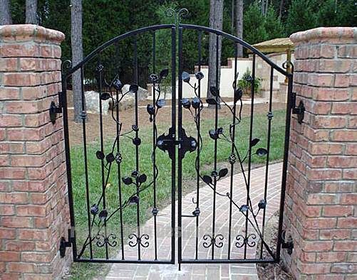 custom wrought iron gate installed in the wall