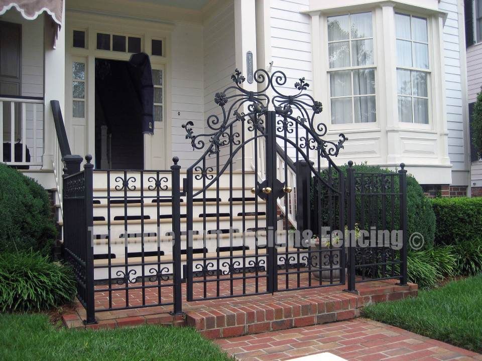 wrought iron gate installed outside house