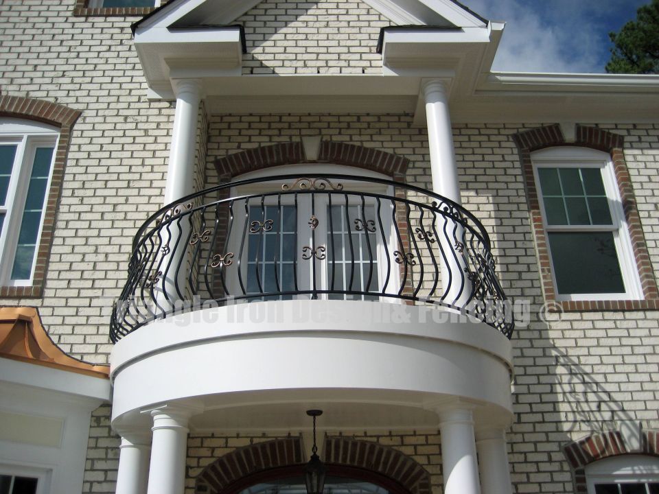 closeup view of the round shaped iron railing in the balcony
