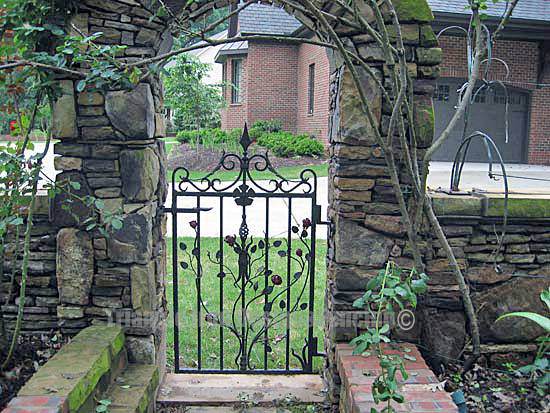 custom iron gate installed at the gate of the garden