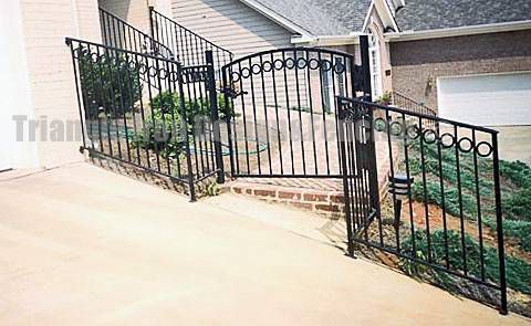 ornamental iron fencing installed at the gate 