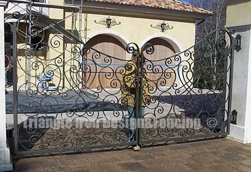 ornamental wrought iron gate installed outside house