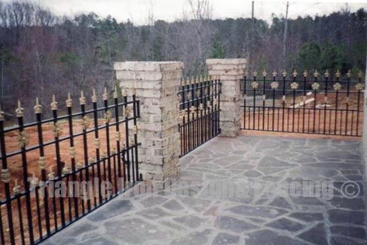 ornamental iron fencing installed outside the house