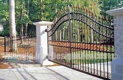wide angle view of the wrought iron gate installed outside garden