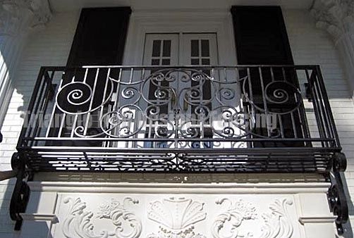 closeup view of the custom iron fencing at the gate