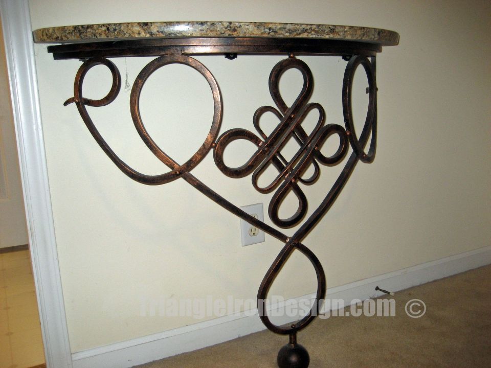 close up view of the iron work in the table