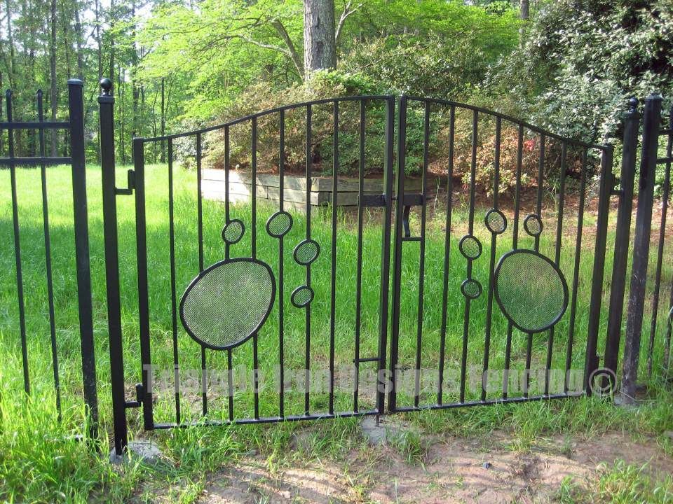 custom iron gate installed at the garden