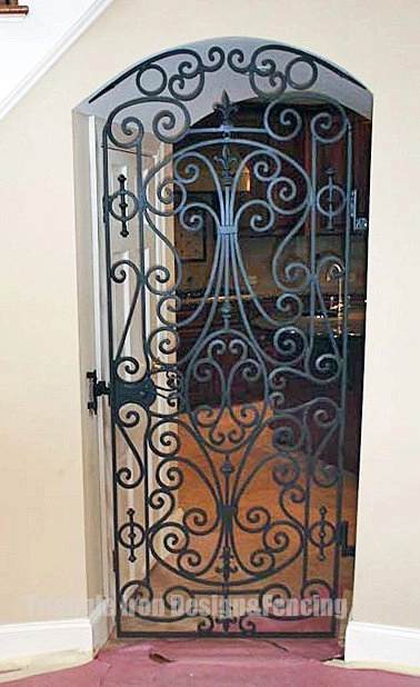 view of ornamental iron door panel outside Kitchen
