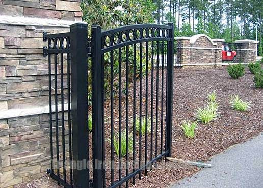 custom iron gate installed at the road