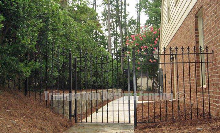 wrought iron gate installed near road