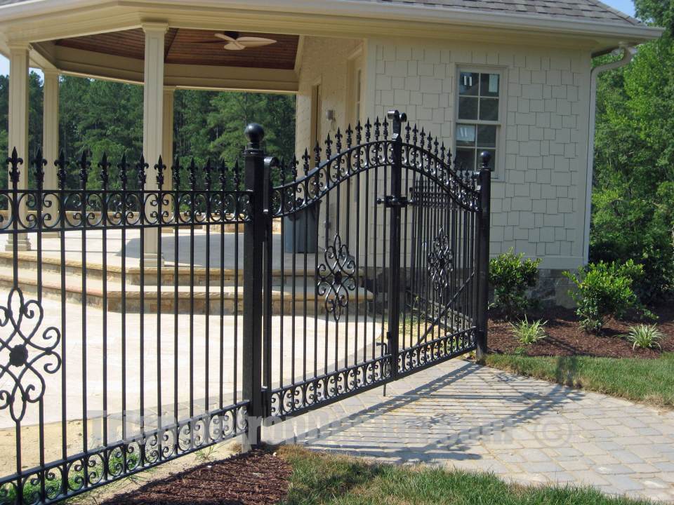 ornamental iron gate installed outside house